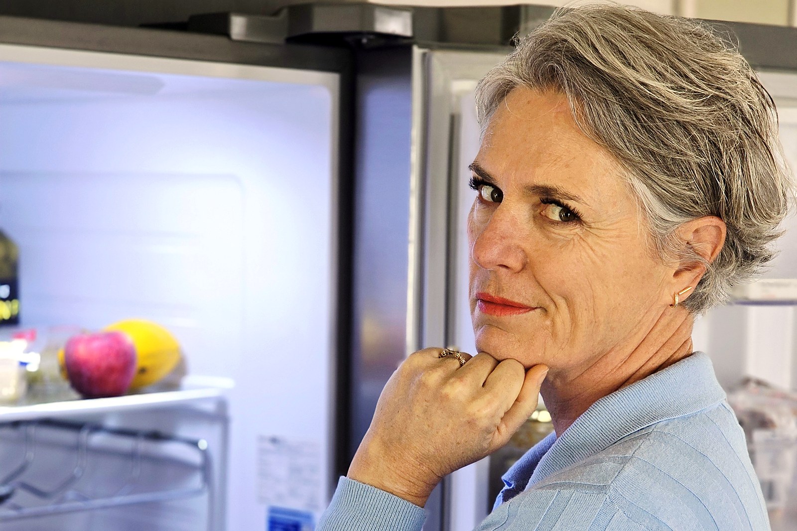 Sorea at her open fridge, caught mid-craving, weighing up what to reach for